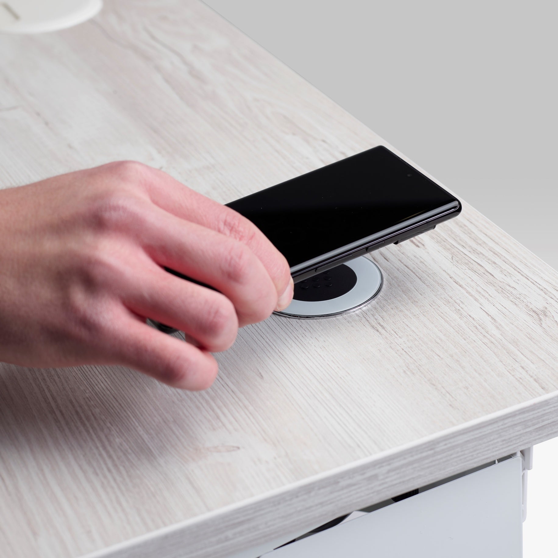 Embedded desktop wireless charger.