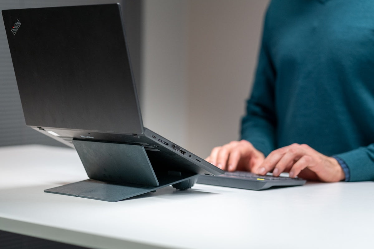 man using Ulrika Black Adjustable Laptop Stand