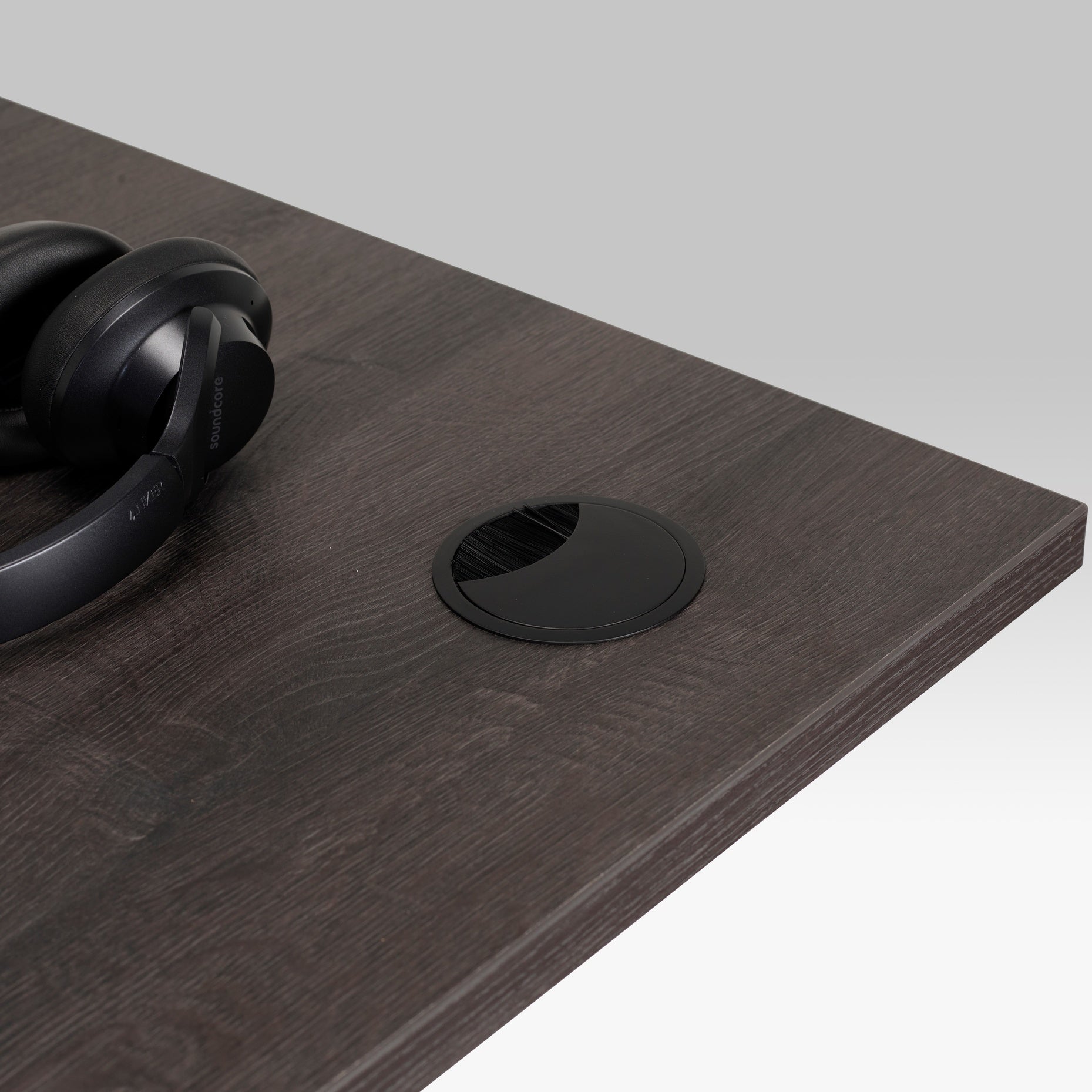 Kinna Executive Metal Cable Port in black on desk.