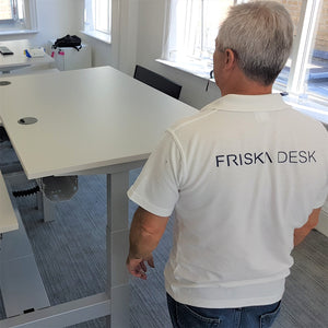 Friska Desk employee installing a standing desk
