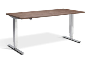Standing desk with real wood laminate top and chrome frame.