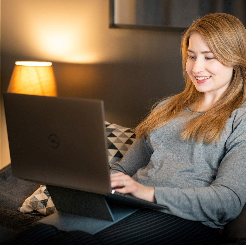 Woman using Ulrika Black Adjustable Laptop Stand