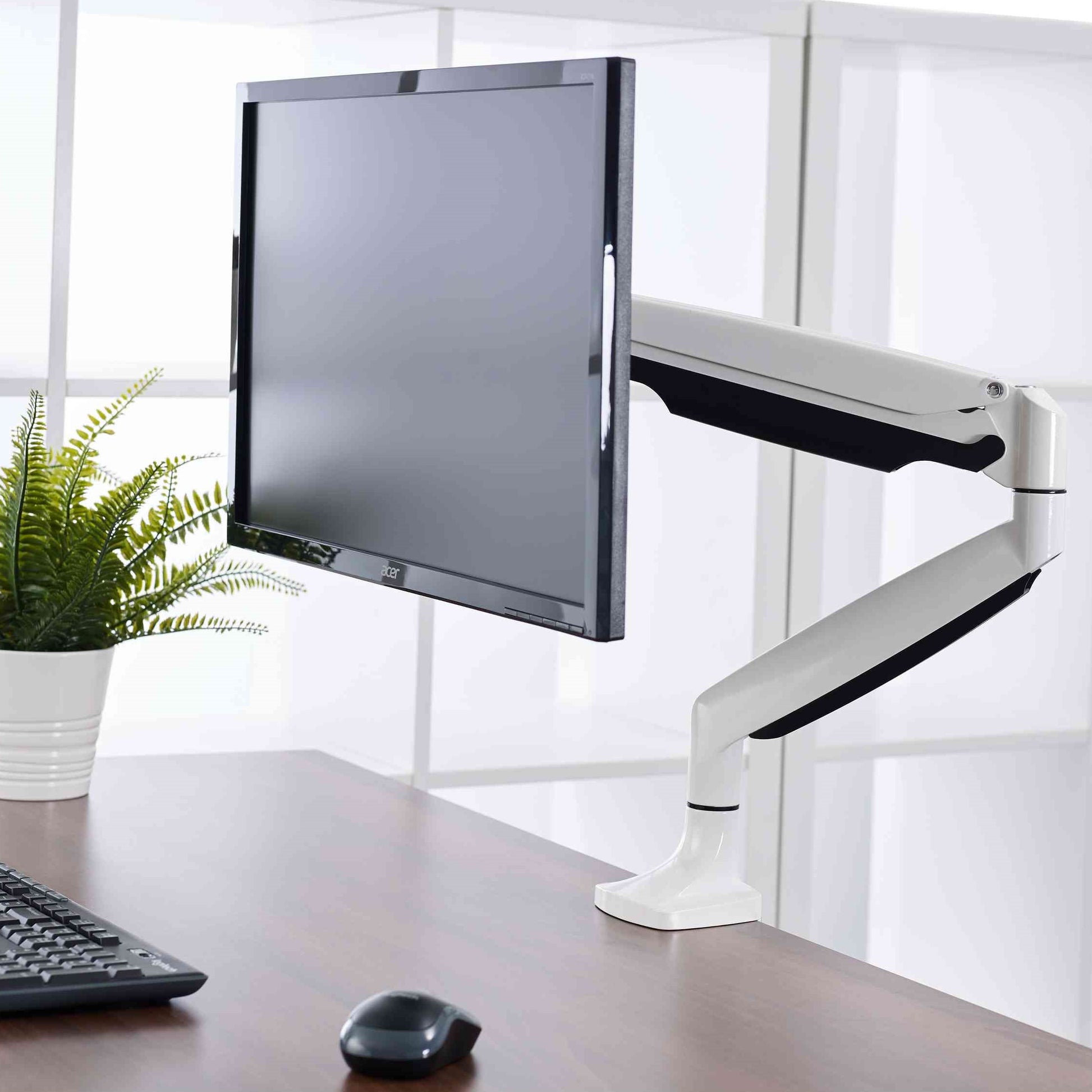 Visby Ergonomic Gas Assisted Single Monitor Arm on desk